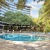 a large swimming pool in front of a building