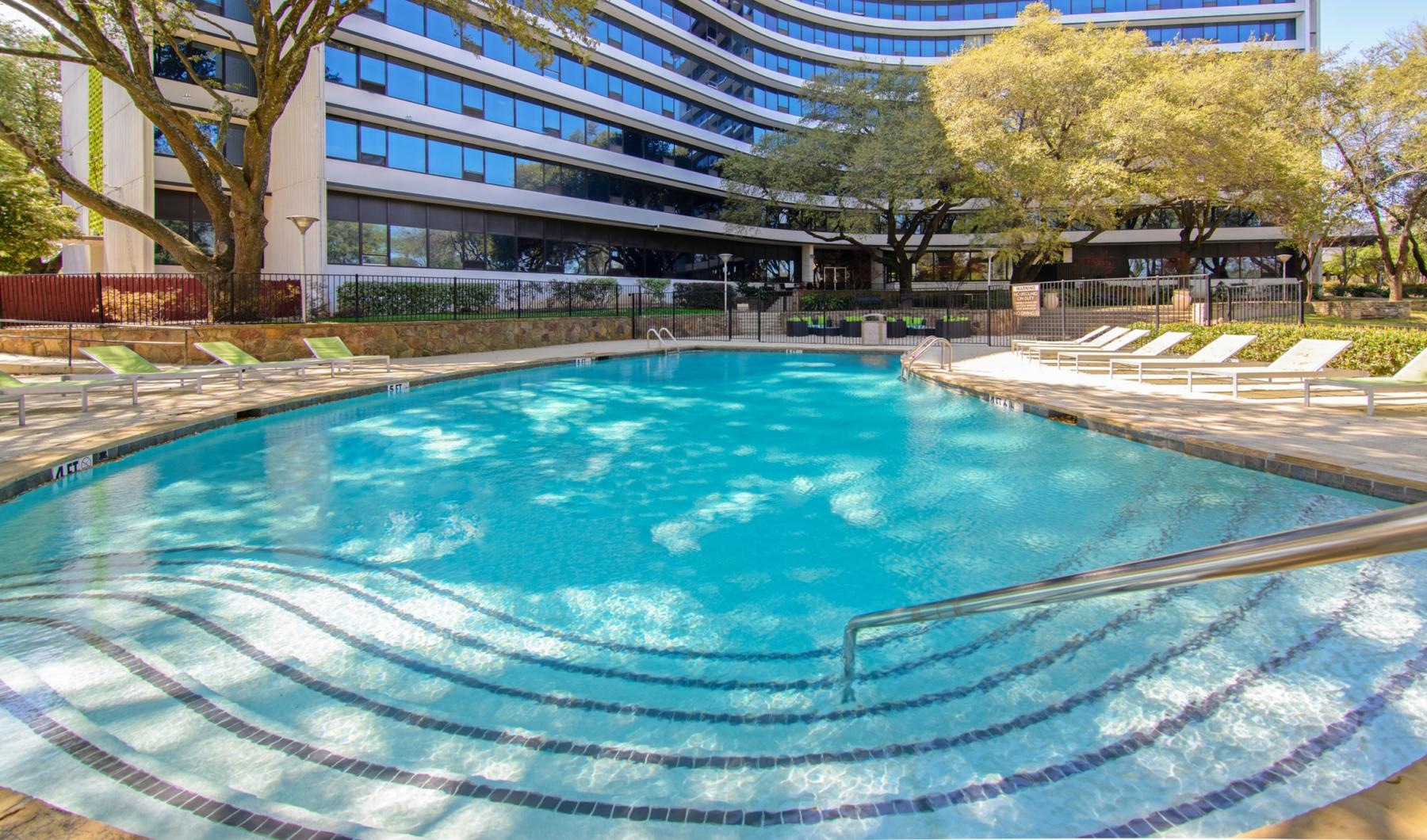 a swimming pool in front of a building